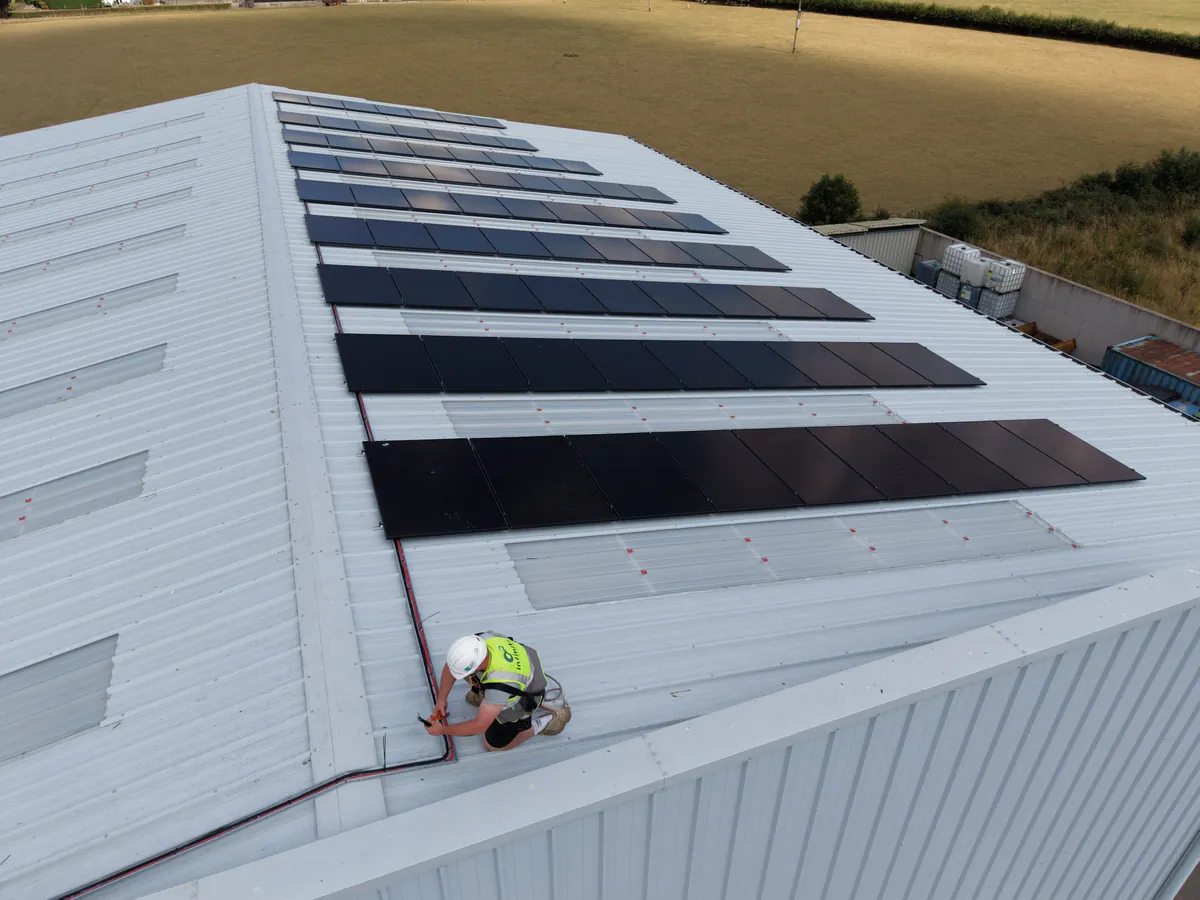 Solar panels across a metal roof at Templetuohy Farm Machinery.